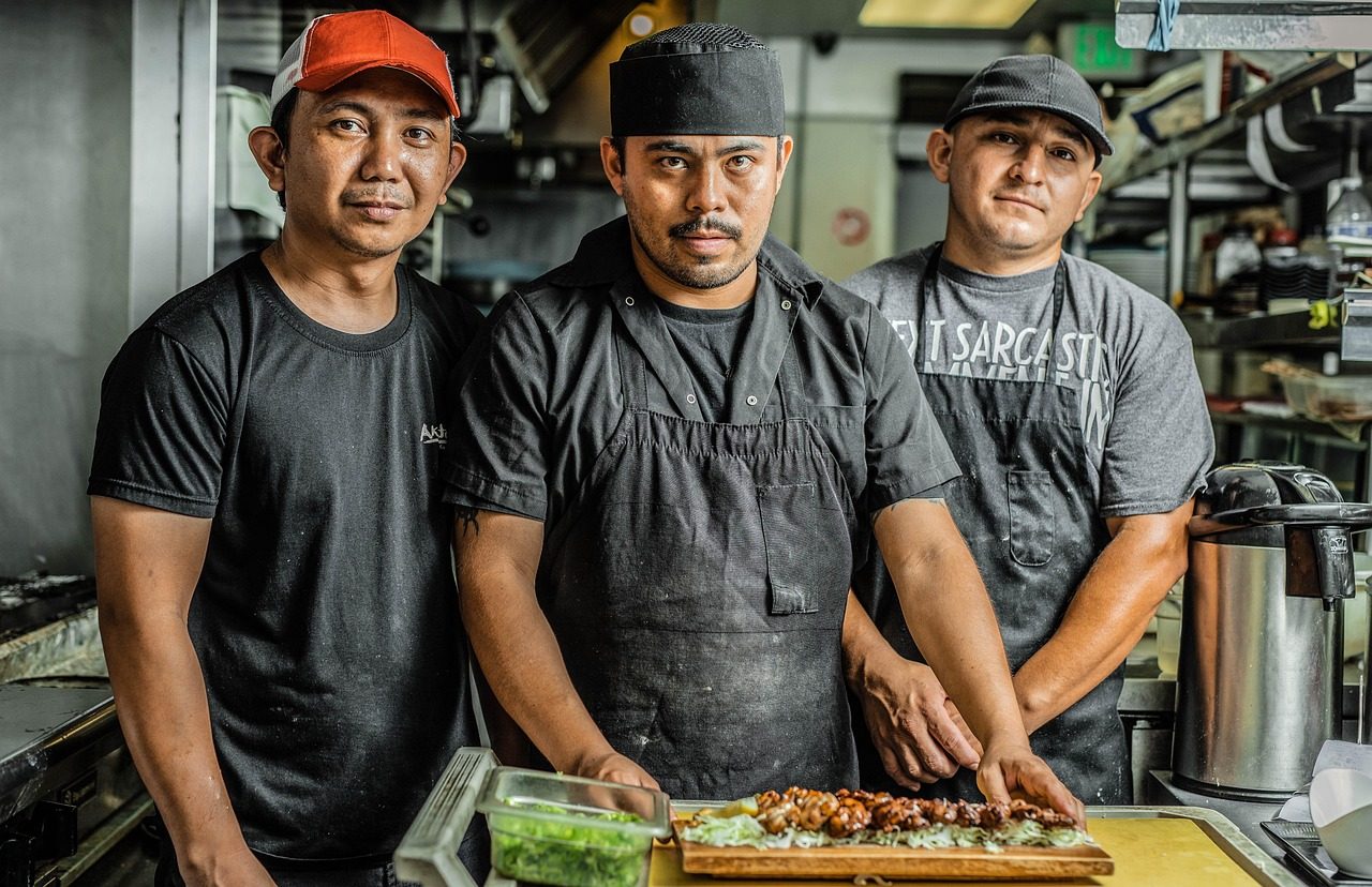 Expert pitmaster preparing authentic smoked meats in professional kitchen